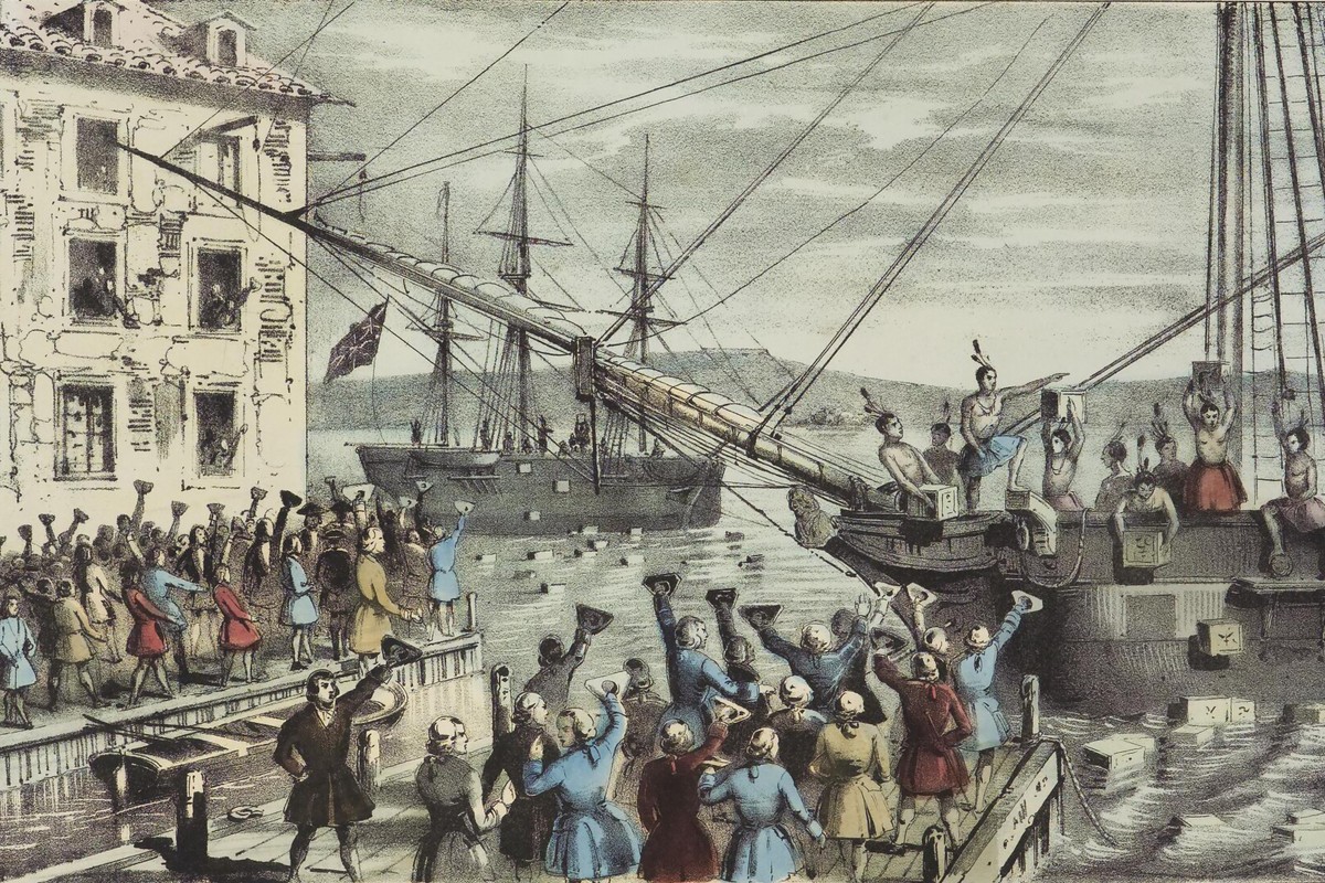 19th-century lithograph of the Boston Tea Party, with colonists on the deck of a ship dumping chests of tea into Boston Harbor as a crowd watches from the wharf